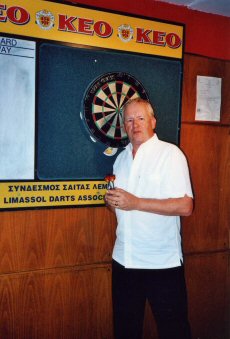 Patrick in the Wembley pub, Limassol, looking for a game of darts